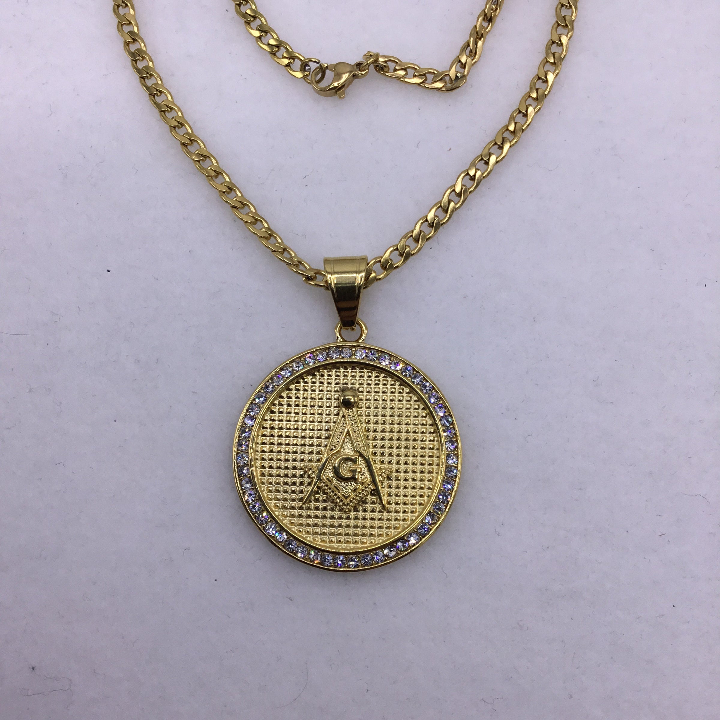 18k gold over stainless steel Medallion with Cubic Zirconia includes Cuban link chain set